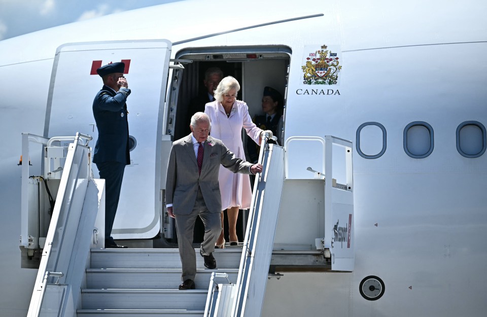 King Charles III and Queen Camilla disembarking a plane in Canada.