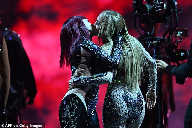 She performed choreography while joined by backup dancers and but has been savaged by fans for her lesbian kiss with another female dancer
