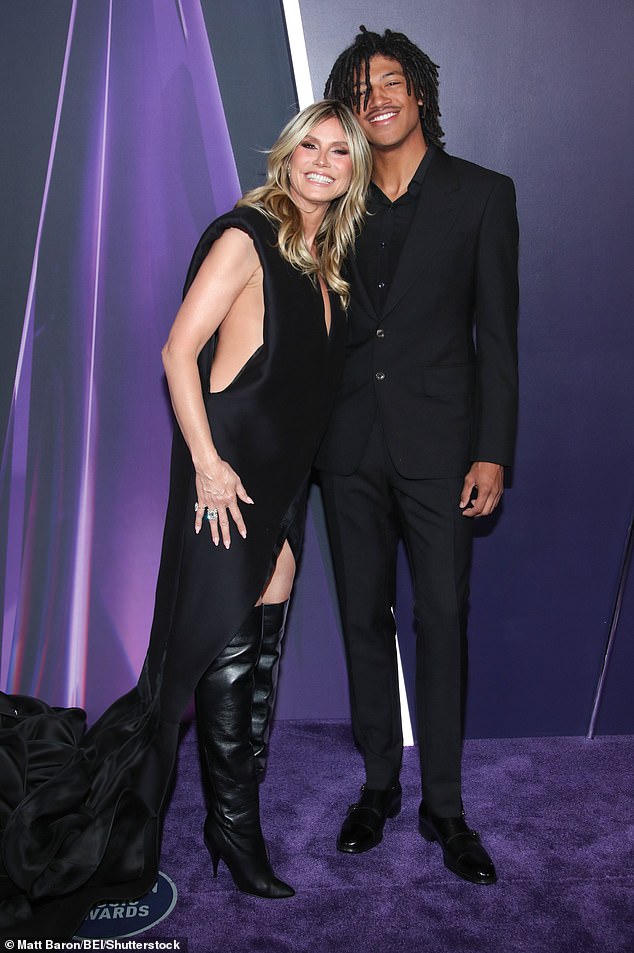 Klum flashed a cheerful smile as she was joined by her son Henry Samuel, 19, for the festivities for a rare appearance together
