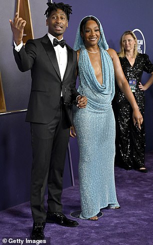 At one point, Haddish was seen crossing paths with singer Jon Batiste while posing for photos on the red carpet
