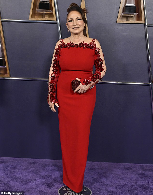 Gloria Estefan - who was one of the performers for the evening - dressed for the occasion in a fitted red dress that clung to her frame and also had a floral trim around the neckline and sleeves