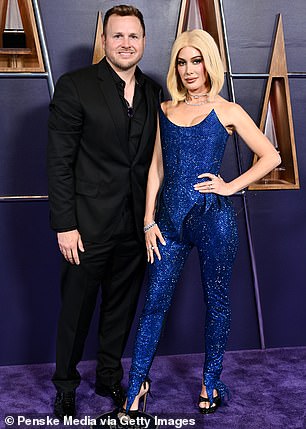 Heidi was also pictured with her husband Spencer Pratt who wore a classic black suit as well as a black dress shirt underneath