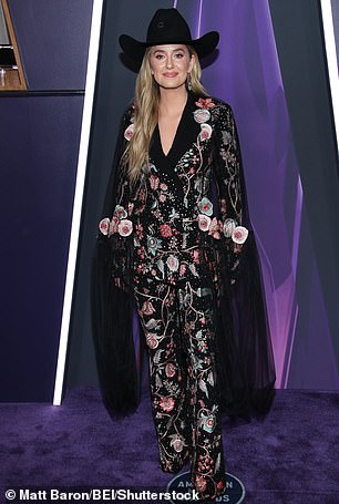 Lainey Wilson paused for snaps wearing a floral-embellished blazer as well as a pair of matching pants from Rahul Mishra