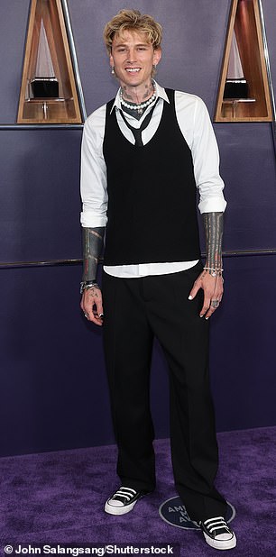 Machine Gun Kelly - who recently welcomed his first child with Megan Fox - was also spotted walking the red carpet ahead of the main event in an ensemble designed by stylist Odile Iturraspe