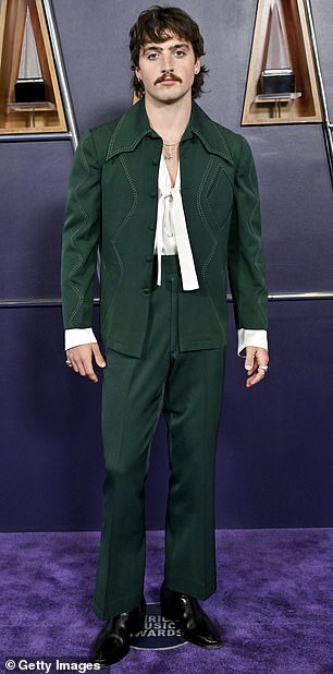 Benson Boone - who took to the stage for a memorable performance - dressed to impress in a pair of dark green pants as well as a matching jacket