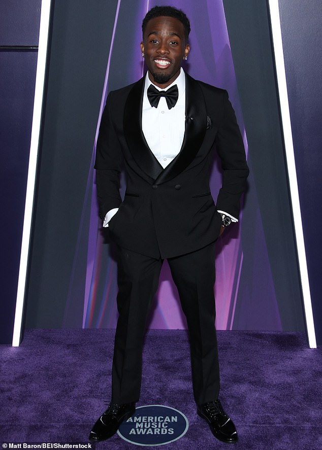 Kai was dapper in a classy black tuxedo which was paired with a white shirt as well as a black bowtie