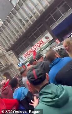 Footage from Water Street - where the chaos unfolded - shows fans surrounding a Ford Galaxy and shouting 'what are you doing?' as it surges back and forth