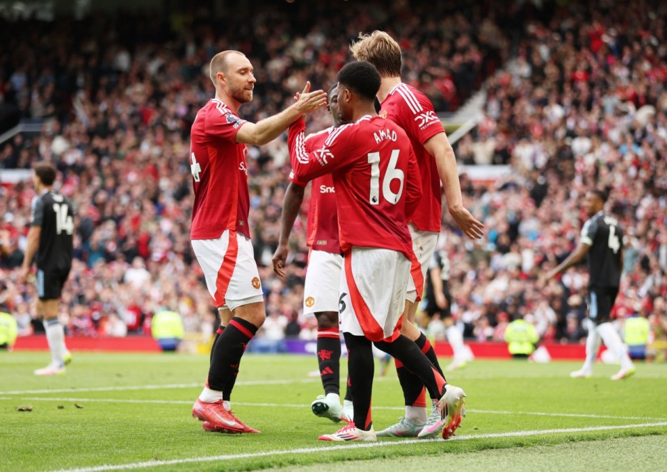 Soccer Football - Premier League - Manchester United v Aston Villa - Old Trafford, Manchester, Britain - May 25, 2025 Manchester United's Amad Diallo celebrates scoring their first goal with Christian Eriksen REUTERS/Chris Radburn EDITORIAL USE ONLY. NO USE WITH UNAUTHORIZED AUDIO, VIDEO, DATA, FIXTURE LISTS, CLUB/LEAGUE LOGOS OR 'LIVE' SERVICES. ONLINE IN-MATCH USE LIMITED TO 120 IMAGES, NO VIDEO EMULATION. NO USE IN BETTING, GAMES OR SINGLE CLUB/LEAGUE/PLAYER PUBLICATIONS. PLEASE CONTACT YOUR ACCOUNT REPRESENTATIVE FOR FURTHER DETAILS..