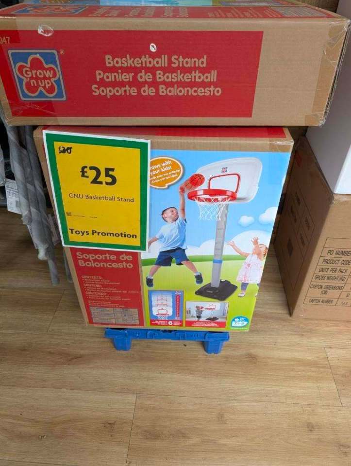 Basketball hoop stand in box.