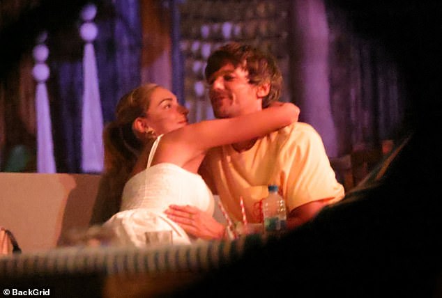 She said: 'There's a lack of synchronicity about the body language here. Either Louis is studying his phone while Zara looks distracted and slightly bored or they seem to attempt to create a more intimate, romantic and even sexual moment that doesn't quite take off'