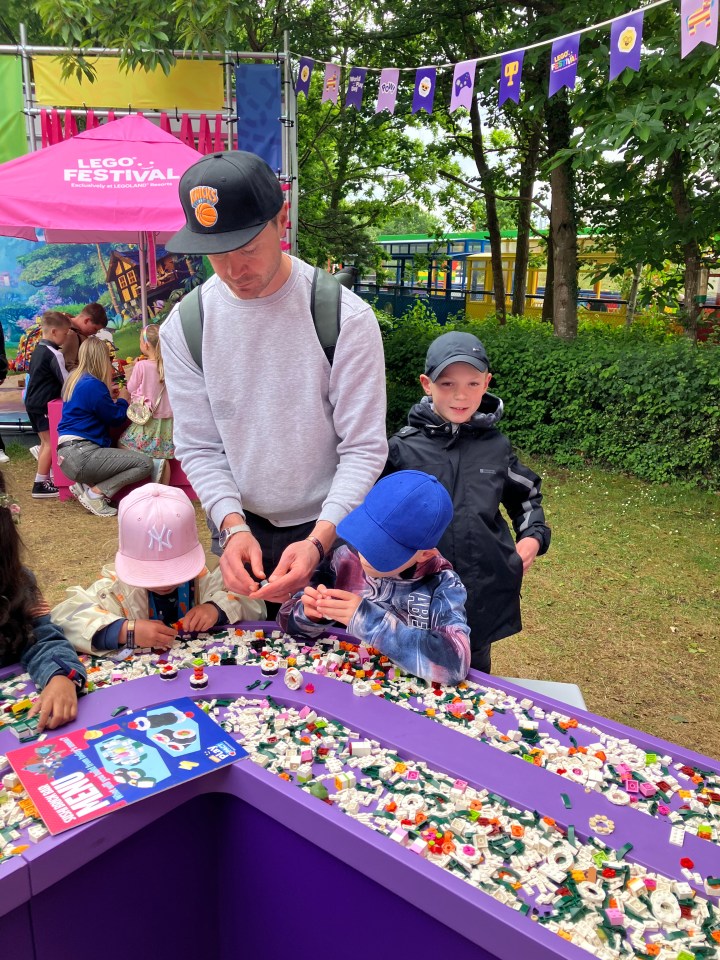 Children building with LEGO bricks at Legoland.