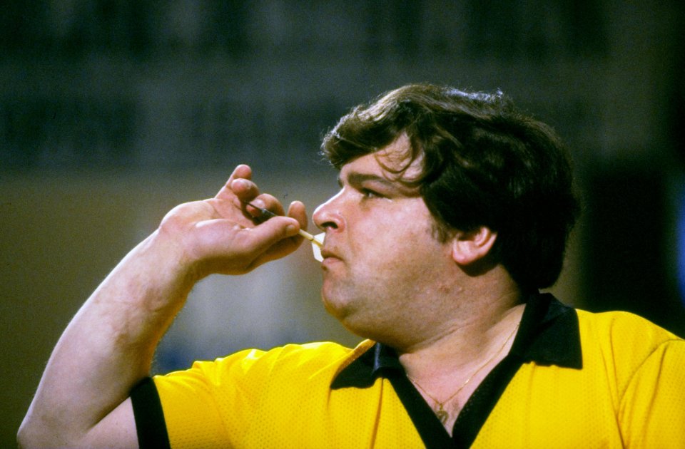 Jocky Wilson preparing to throw a dart at the British Open.
