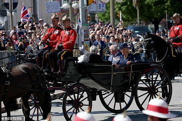 Queen Camilla and King Charles are greeted by cheering crowds and British flags in Ottawa on Tuesday