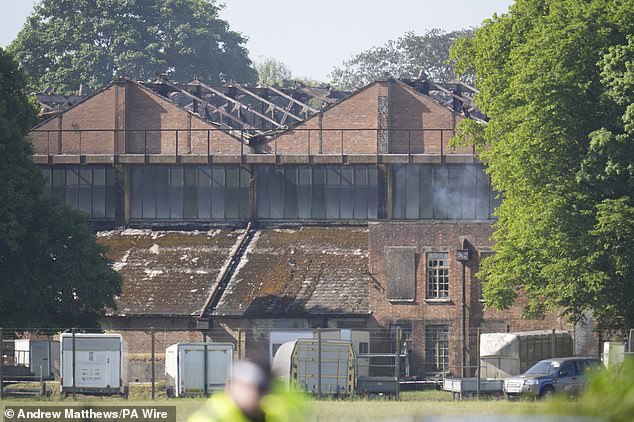 Pictured: Damaged buildings at the scene of the fire at a former RAF base which is home to more than 50 specialist businesses focused on classic car restoration and engineering