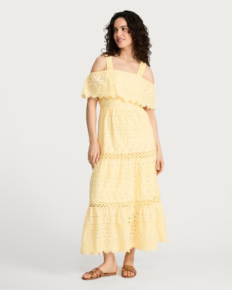 Yellow tiered midi dress with eyelet detailing.