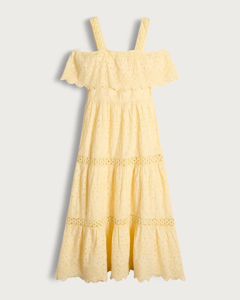 Yellow tiered midi dress with eyelet detailing.