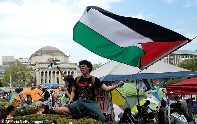 Trump has waged war on elite universities, accusing them of antisemitism and blasting their ' woke ' ideology. Pictured: pro-Palestine protestors at Columbia University