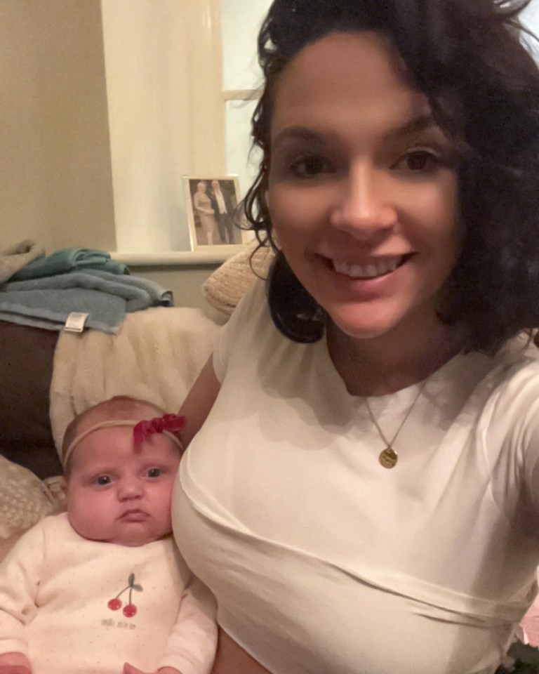 Woman holding a baby.
