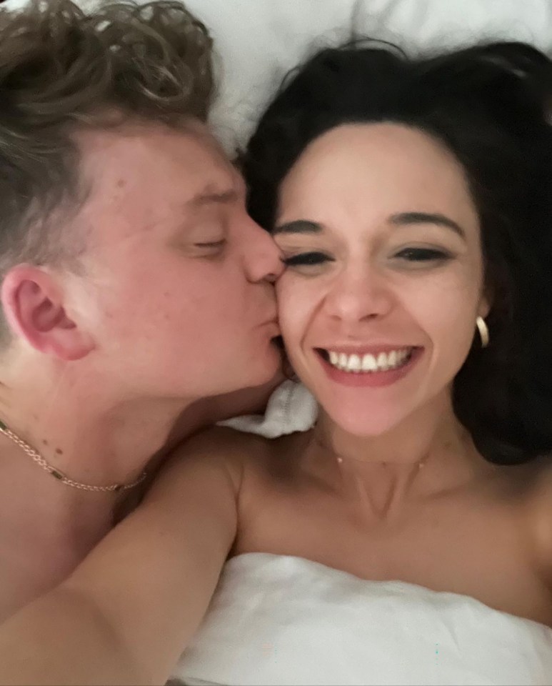 A man kissing a woman on the cheek.