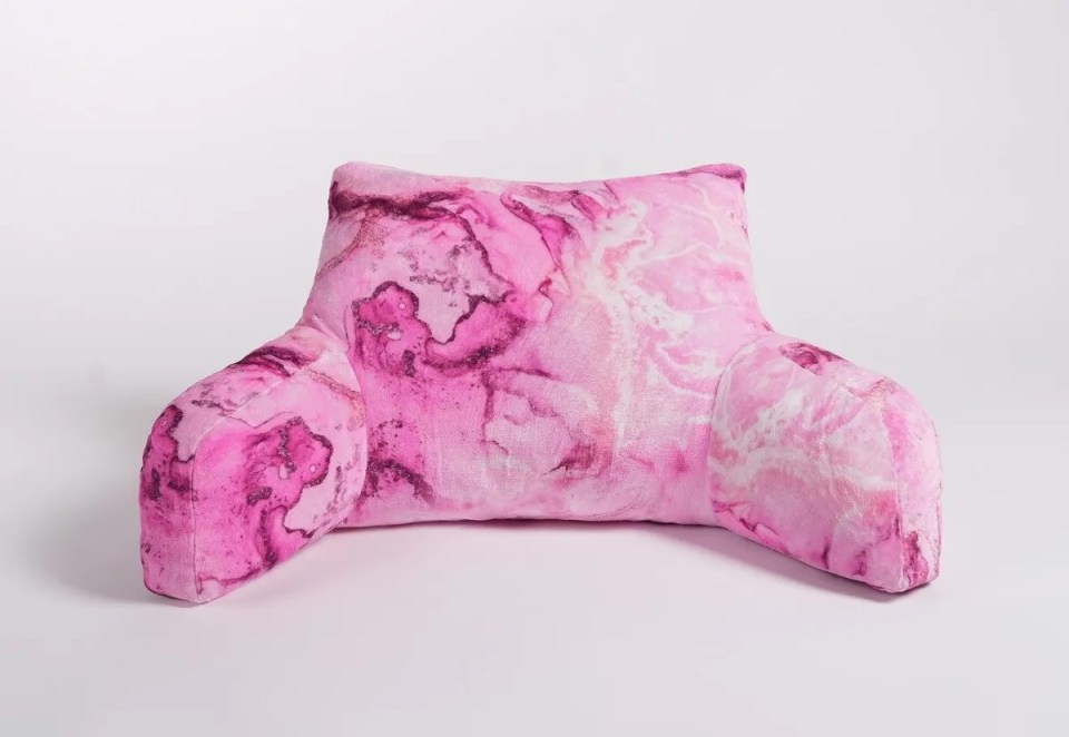 Pink cuddle cushion with marble pattern.