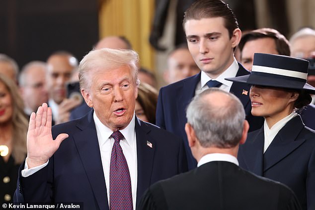 President Donald Trump with son Barron and first lady Melania at his second inauguration