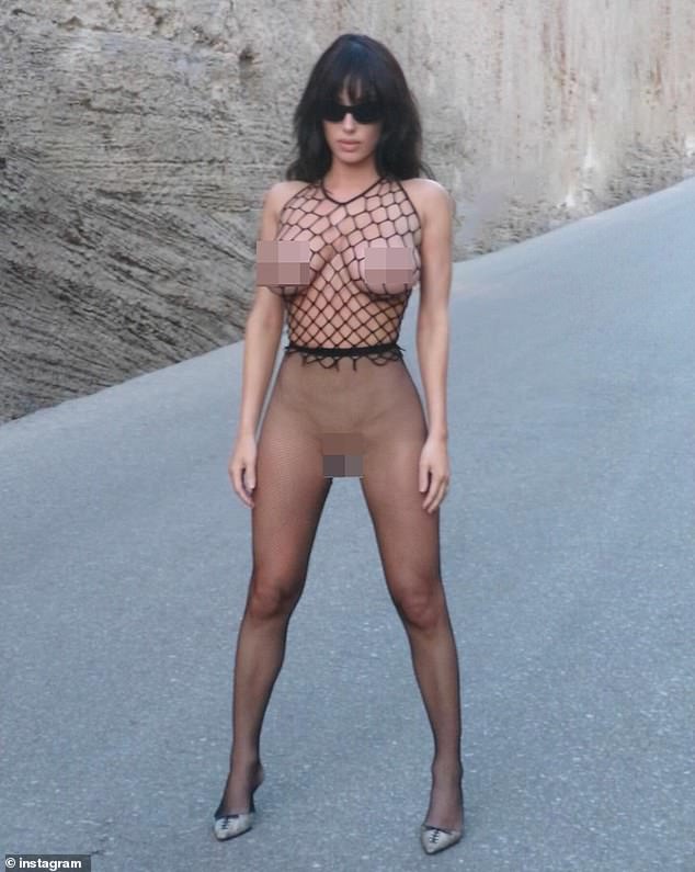 With her skin-baring, scandalous look, she wore silver, pointed-toe kitten heels with a contrasting, black lace-up design