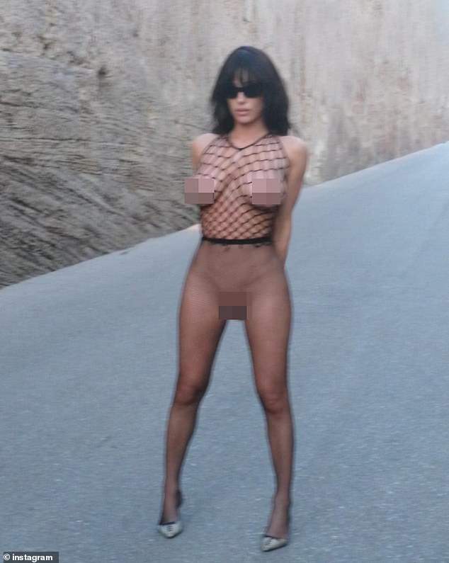 She left her long, jet black tresses down, and in addition to having wispy fringe covering her face, she also sported a pair of dark sunglasses