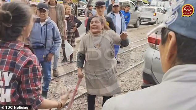 It comes as shocking new footage shows the tourist being attacked and threatened with sticks by furious locals who allegedly burned her belongings
