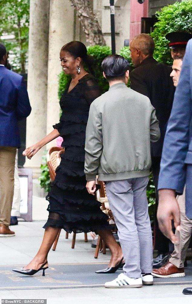 The couple was spotted leaving The Lowell Hotel accompanied by a full entourage of Secret Service agents who cleared the sidewalk as the Obamas left the the boutique property
