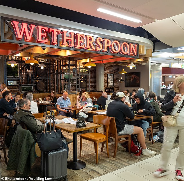 Thanks to Wetherspoons, travellers departing from five major UK airports - including London Gatwick (pictured) can still enjoy a pint for little over a fiver