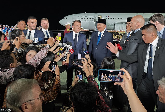 Pictured: Macron arriving in Jakarta, Indonesia yesterday as he continues his South East Asian tour