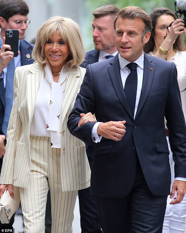 Pictured: French president Emmanuel Macron and his wife Brigitte arrive at Hanoi University of Science and Technology
