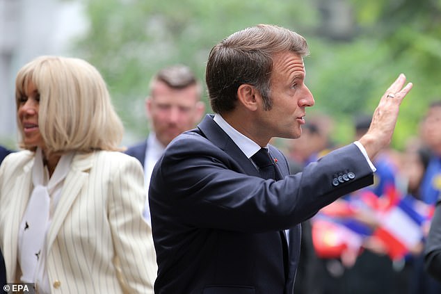 Elysee officials denied the couple were having a spat and instead said they were simply 'having a laugh' in a 'moment of closeness'. Their knee-jerk reaction sent the rumour mill into overdrive, with state radio channel France Info claiming it reflected 'simmering tensions within the Elysee's communications unit'. Pictured: Emmanuel Macron (R) and his wife Brigitte Macron (L)