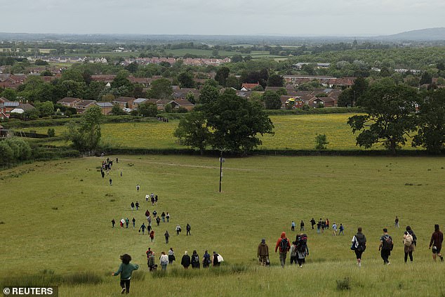 An air ambulance was seen landing in a nearby field on Monday during the race