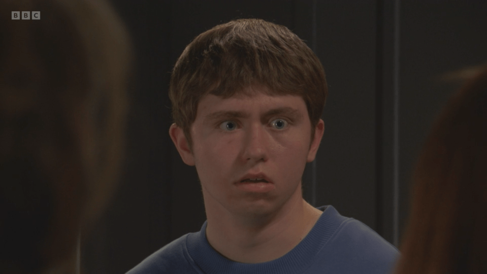 Screenshot of a young man with a surprised expression.