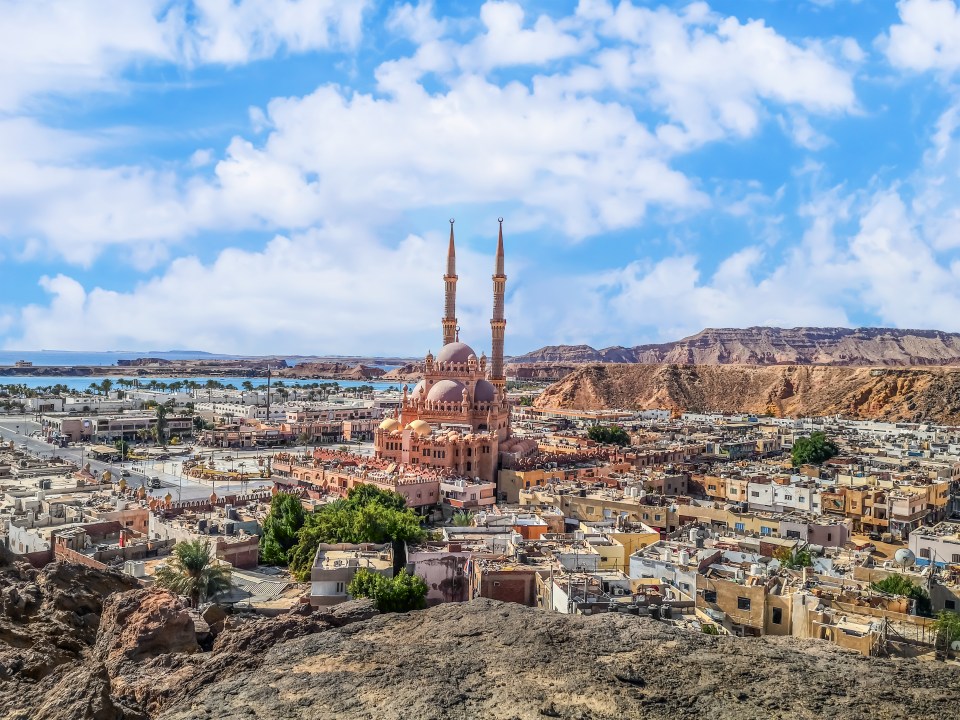 Aerial view of Sharm El Sheikh's old city, featuring a mosque and the Red Sea.