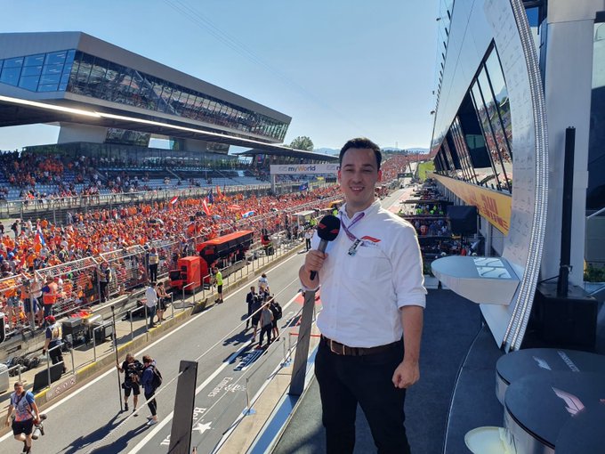 Reporter at a Formula 1 race.