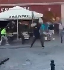 One video shows supporters throwing chairs toward police who are intervening