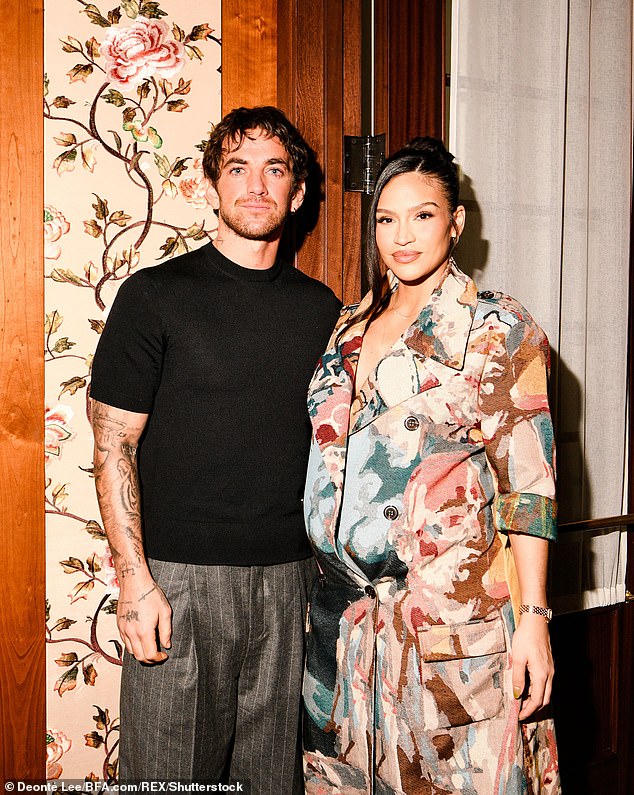 Insiders say the baby arrived slightly ahead of schedule, but Cassie and her child are healthy and well (Cassie and her husband pictured in March)
