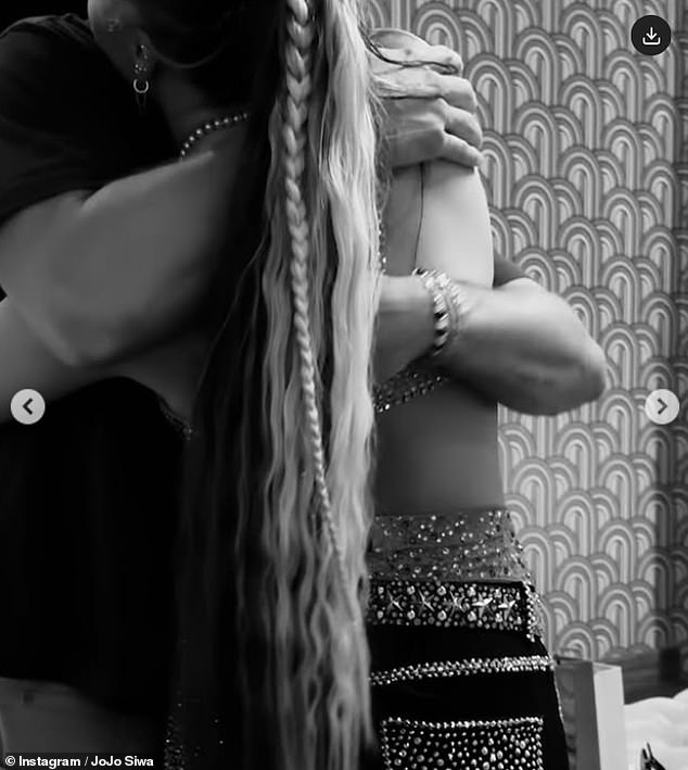 Her post included a slew of snaps from her performance, including a sweet image that showed herself and Chris embracing backstage