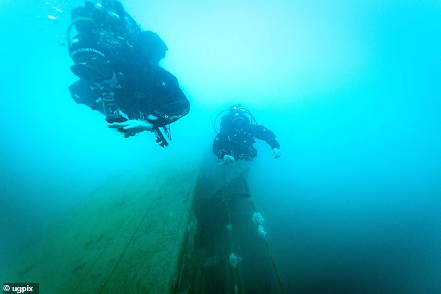Divers can only spend ten minutes at a time on the wreck - with the dangers of the unforgiving conditions and poor visibility 150ft below the surface underlined by the tragic loss of a Dutch diver on May 9 during recovery efforts