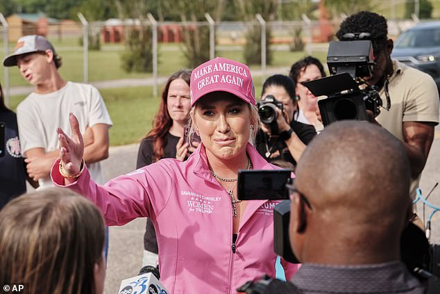 Wearing a hot pink MAGA hat, Savannah told TMZ that she is 'so grateful that I'm going to leave here with my dad' after an 'insane' two years of her trying to get him and Julie freed