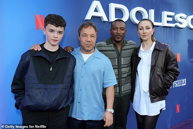 With Stephen and Ashley rocking short sleeve shirts, fellow co-star Erin Doherty looked effortlessly stylish in a white shirt dress
