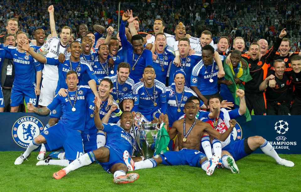 Chelsea football team celebrates winning the Champions League trophy.