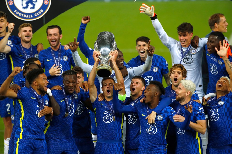 Chelsea players celebrating with the European Super Cup trophy.