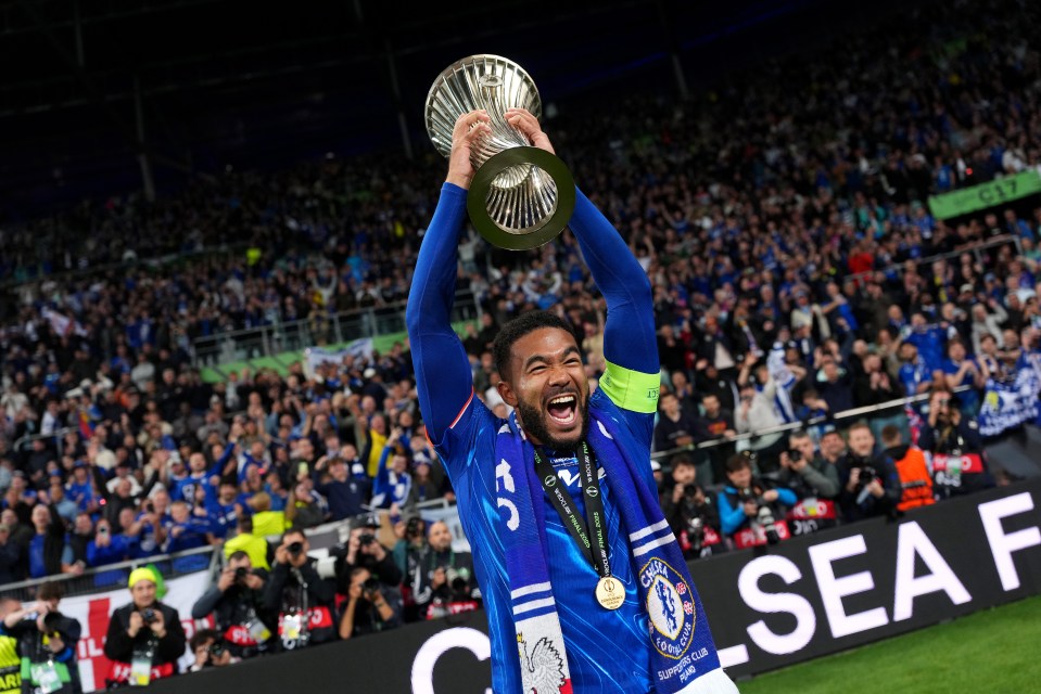 Reece James of Chelsea celebrates with the UEFA Conference League trophy.