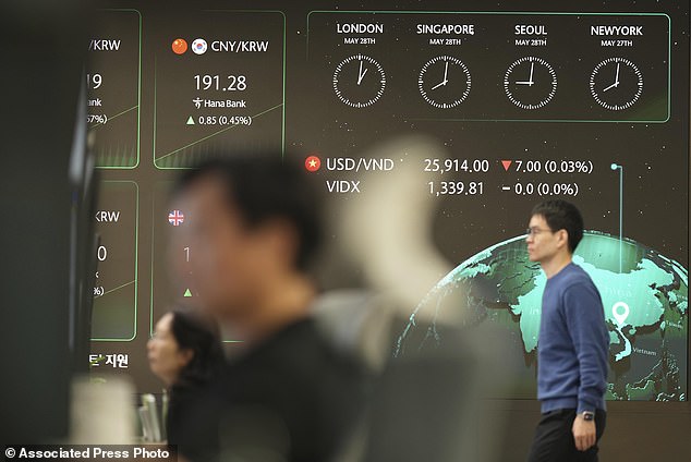 The screens show the foreign exchange rates are seen at a dealing room of Hana Bank in Seoul, South Korea, Wednesday, May 28, 2025