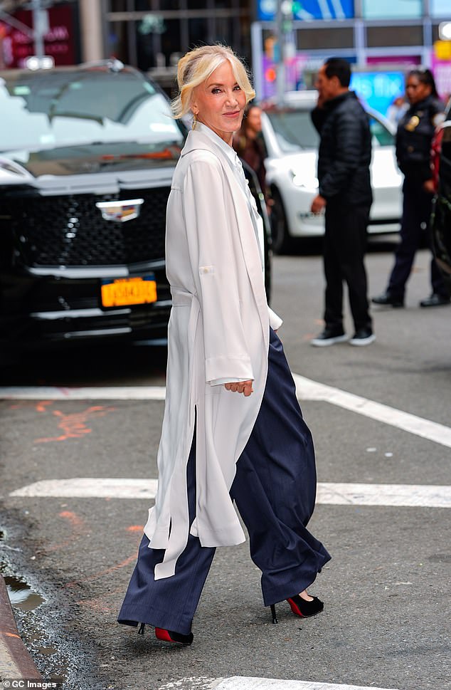 Huffman added height to her outfit with a pair of black peep-toe heels. She accessorized with large gold hoops