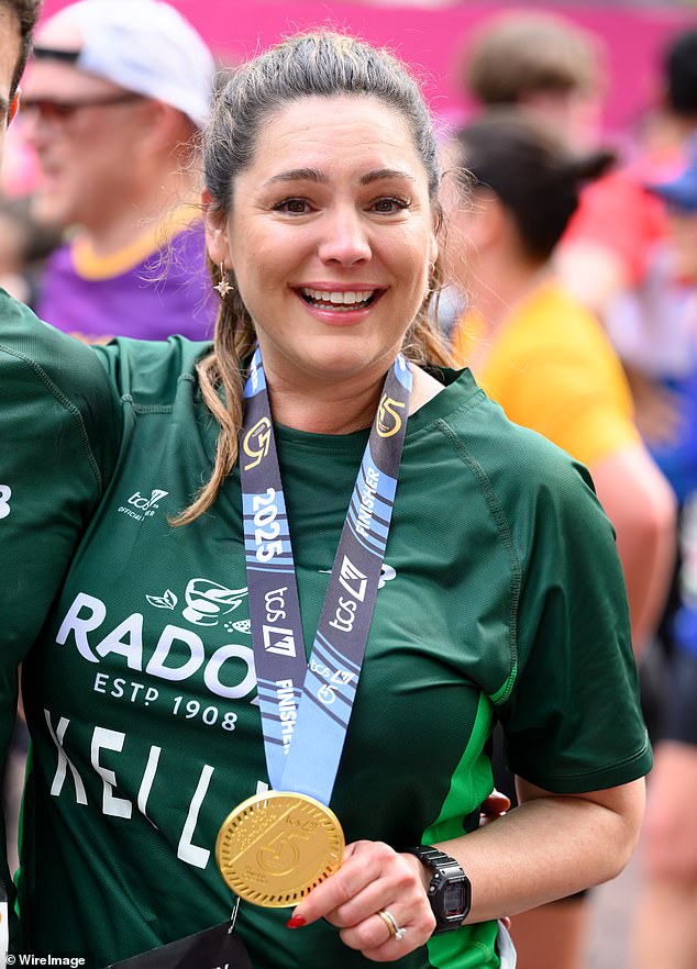 Kelly recently ran the 2025 London Marathon - and proudly poses with her medal