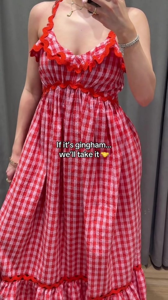 Red and white gingham dress with red scalloped trim.